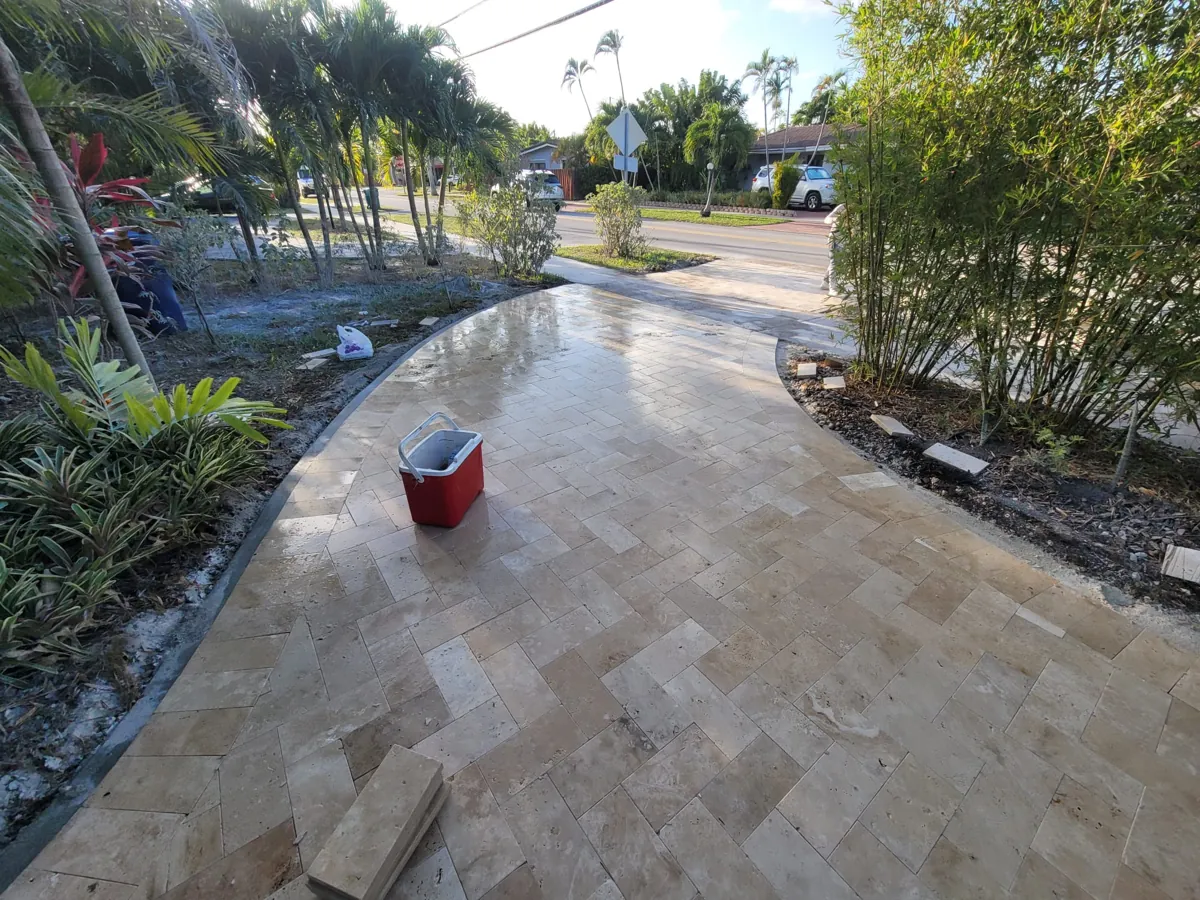 Curving warm stone walkway through landscaping